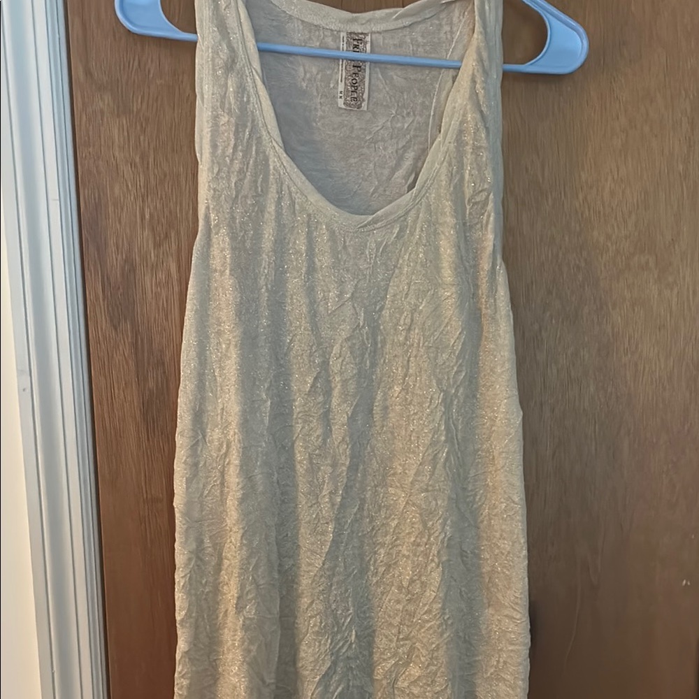 Free people tank metallic gold with T strip back and scoop neck front